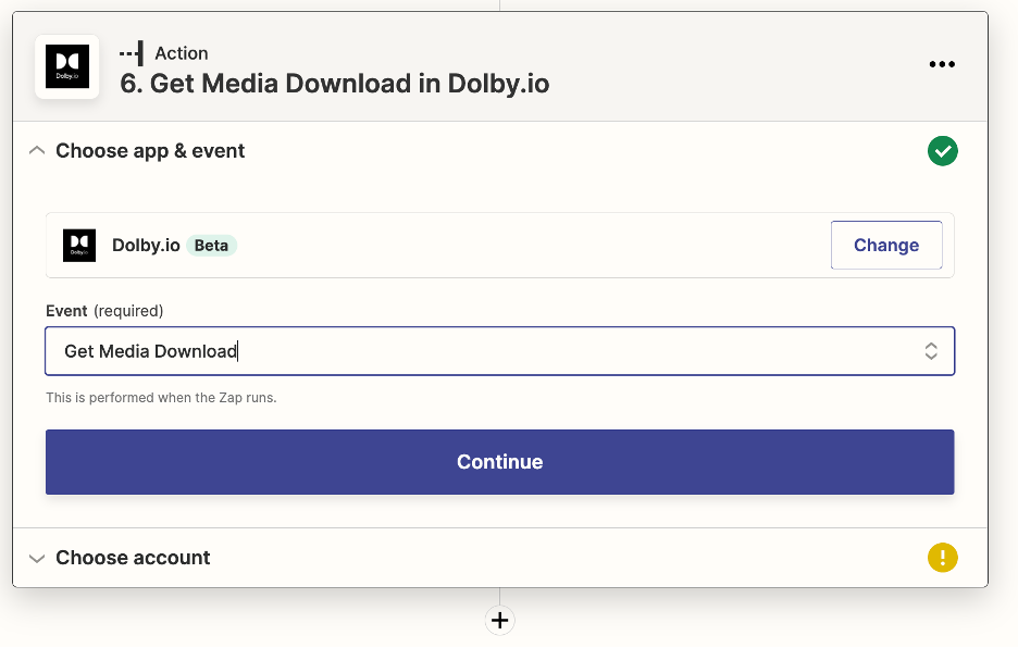 The 'Choose app & event' menu for the app Dolby.io is pictured. The Event selected is 'Get Media Download.' Below, there is a large, blue, rectangular button that says 'Continue' for the user to press.