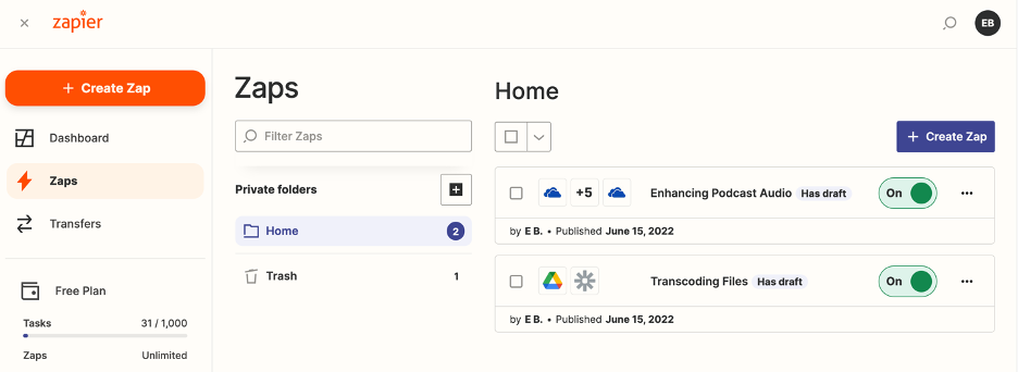 Shown is the Zapier dashboard once a user is signed in. On the left, there is a way to select different menus to view, selected is the menu 'Zaps'. Within that menu, there are different 'Folders'. Selected is the folder 'Home'. Inside of 'Home', there are two different zaps shown. One is titled 'Enhancing Podcast Audio' and is listed as being 'On' currently. The second zap, the one created in this guide, is called 'Transcoding Files' and is also listed as being 'On'.
