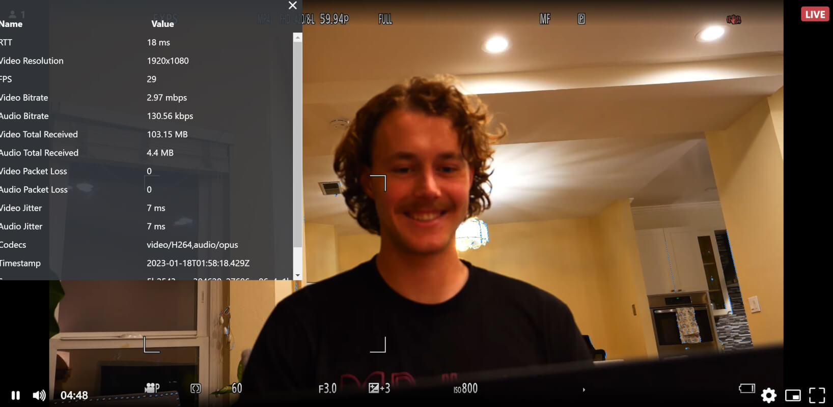 Image of the author via the camera, connected to the encoder which is streaming WebRTC to an online viewer. The image highlights the trip statistics including a round trip time of 18 ms for a 1080p stream.